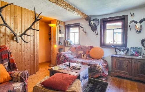a living room with a couch and a table at Gorgeous Home In Saalfeld With Sauna in Saalfeld