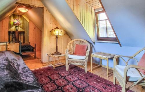 a room with a couch and a table and a bed at Gorgeous Home In Saalfeld With Sauna in Saalfeld