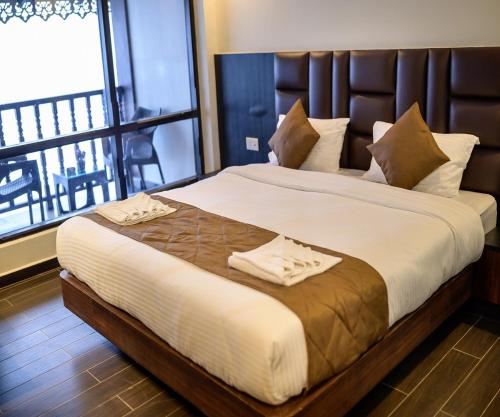 Postel nebo postele na pokoji v ubytování Istana Resort & Spa