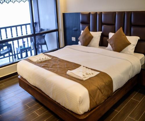 Postel nebo postele na pokoji v ubytování Istana Resort & Spa