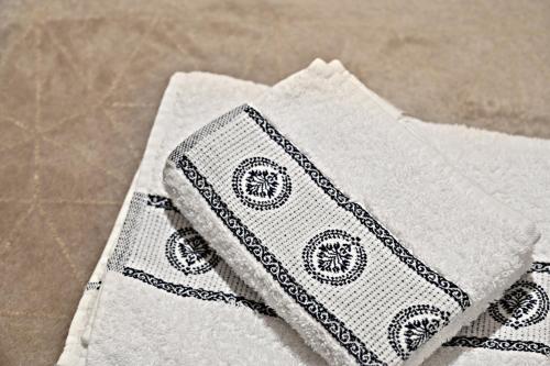 a close up of two white napkins on a table at Casina modesta in Somma Lombardo