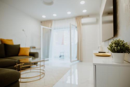 a living room with a couch and a table at Apartman 007 in Vukovar