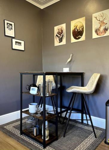a desk and a chair in a living room at The Lytham Cottage in Lytham St Annes