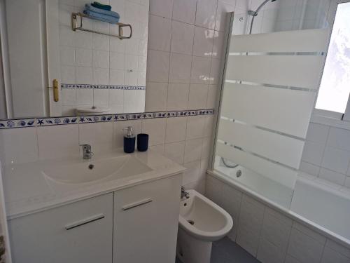 a white bathroom with a sink and a toilet at MARBELLA - MIJAS in Mijas