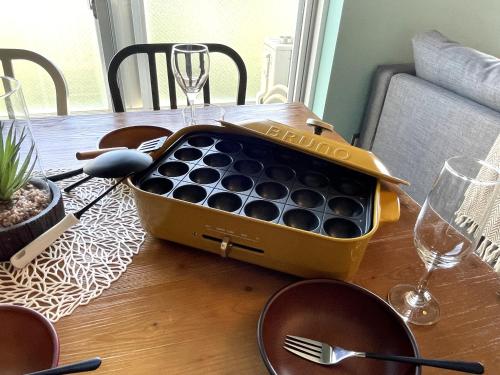 a box of wine sitting on top of a table at 365BASE outdoor hostel in Hamamatsu