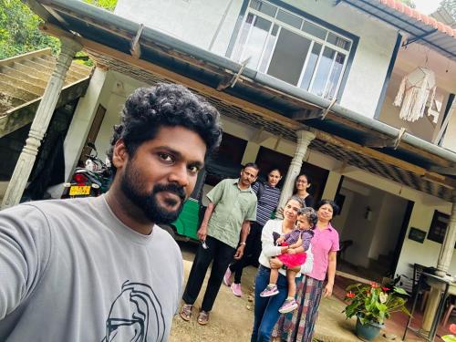 a group of people standing in front of a house at Misty View Inn in Ella
