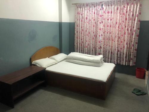 Postel nebo postele na pokoji v ubytování HOTEL TRILOK