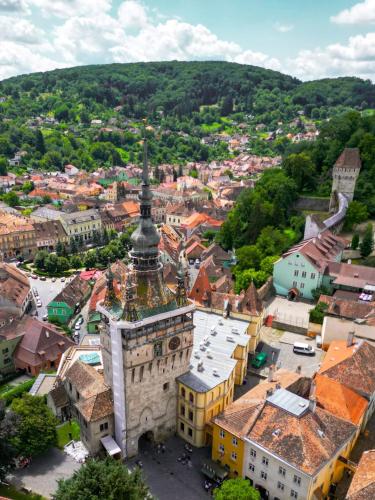 an aerial view of a town with a building at The Throne - M Museum Hotel in Sighişoara