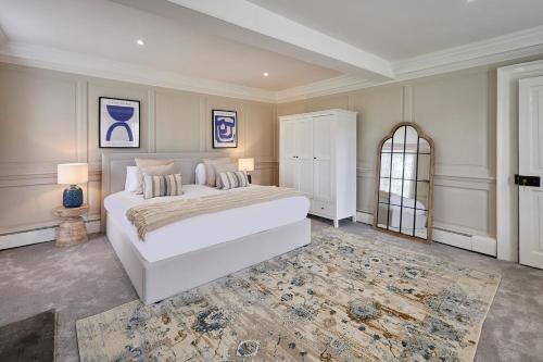 a bedroom with a large white bed and a window at Stay House - Rural Retreat in Kepwick
