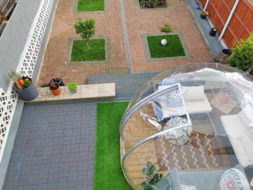 an overhead view of a patio with a glass table at Large Double Room with Private Toilet and Shower in Southend-on-Sea