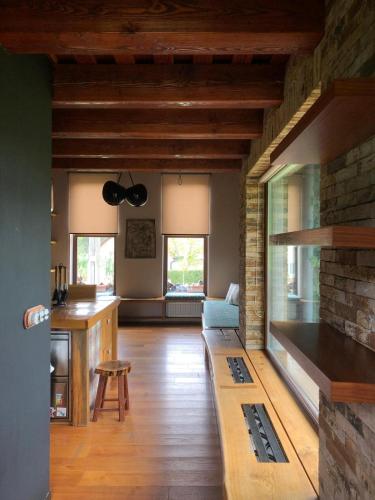 a living room with a couch and a brick wall at Záhradný domček in Levoča