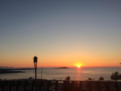a sunset from the balcony of a condo at Bellevue del Golfo Hotel & Spa in Sferracavallo