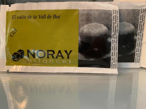 a book sitting on top of a white refrigerator at Alberg Vall de Boi in Barruera