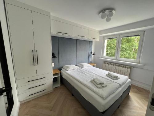 Posteľ alebo postele v izbe v ubytovaní LTC Apartments Wzgórze św Maksymiliana