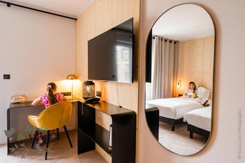 Ένα ή περισσότερα κρεβάτια σε δωμάτιο στο Hôtel Le Patio de Victor, Lorient