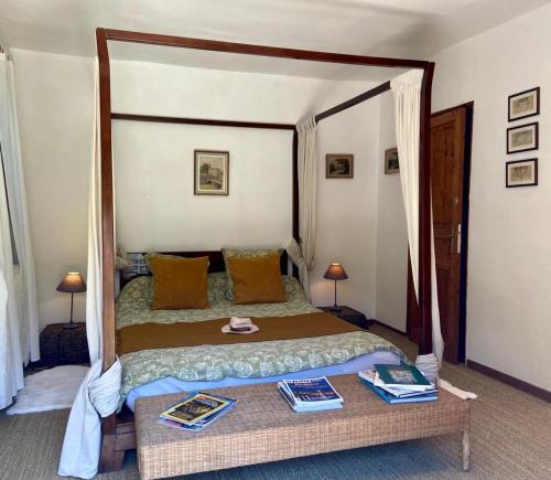 Postel nebo postele na pokoji v ubytování Maison d'Hotes Le Chai d'Armagnac