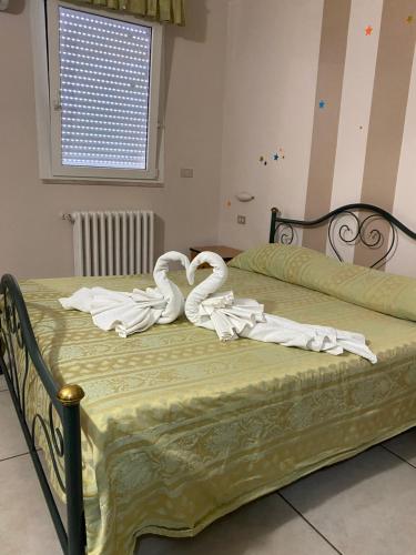 En eller flere senge i et værelse på Hotel Esperia