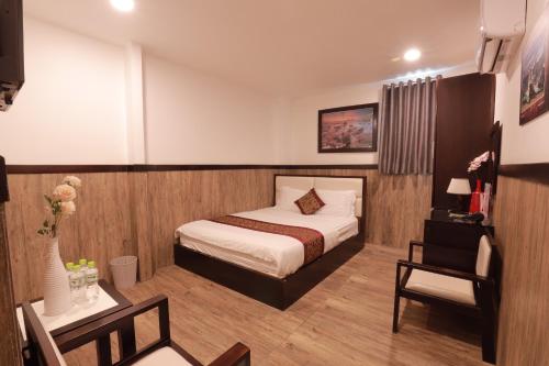 Postel nebo postele na pokoji v ubytování Hotel Minh Hang