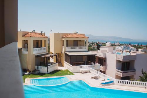 arial view of a villa with a swimming pool at Villa Cook with pool and terraces with sea views in Dhaskalianá
