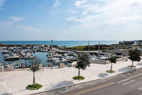 a view of a marina with boats in the water at THE VIEW B&B, terrace & more in San Foca