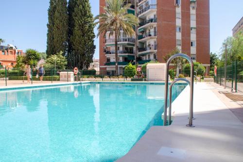 a large swimming pool in a apartment complex at Las Estrellas 301 in Torremolinos