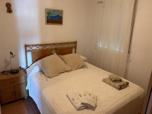 Säng eller sängar i ett rum på Casa en Paseo Los Nietos Zona Arenal