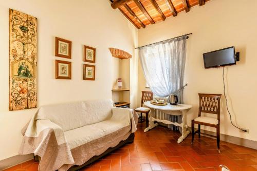 a living room with a couch and a table at Hotel San Michele in Cortona