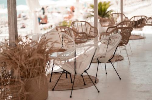 a group of chairs and a table in a restaurant at Agriturismo Giorgio in Mattinata