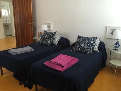 Katil atau katil-katil dalam bilik di Verde Blu Lakefront Boutique Holiday Apartments Trevignano Romano