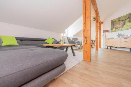 a living room with a couch and a table at Waidla-Studio in Freyung