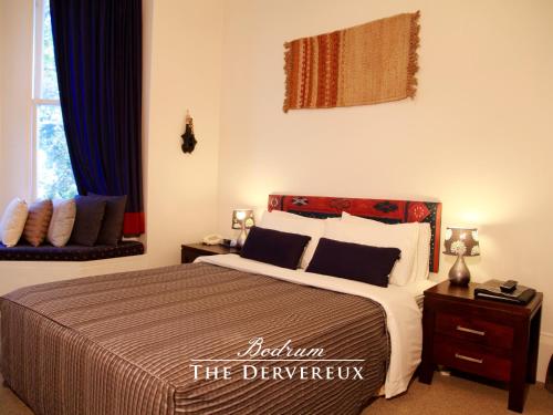 a bedroom with a large bed and a window at The Devereux Boutique Hotel in Auckland