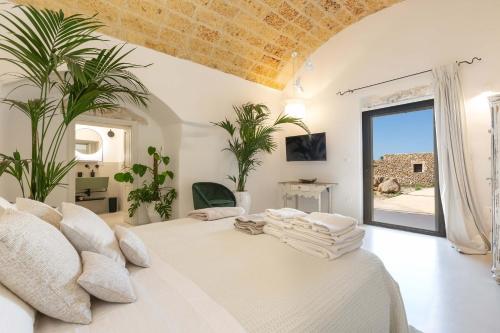 Ένα ή περισσότερα κρεβάτια σε δωμάτιο στο Masseria Marchese by Perle di Puglia