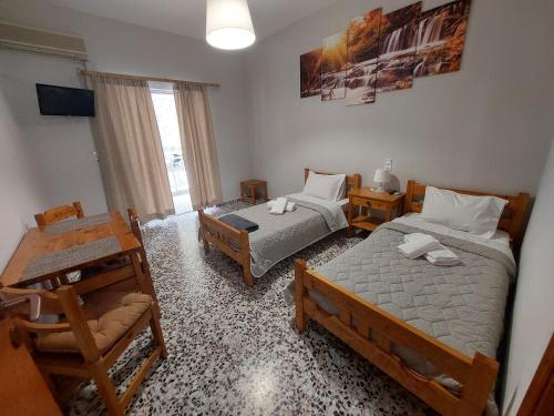Postel nebo postele na pokoji v ubytování Zagas Hotel Ξενοδοχειο Ζάγκας