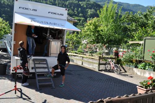 a woman standing in front of a food truck at Hotel Ristorante Franca in Tovo di Sant'Agata