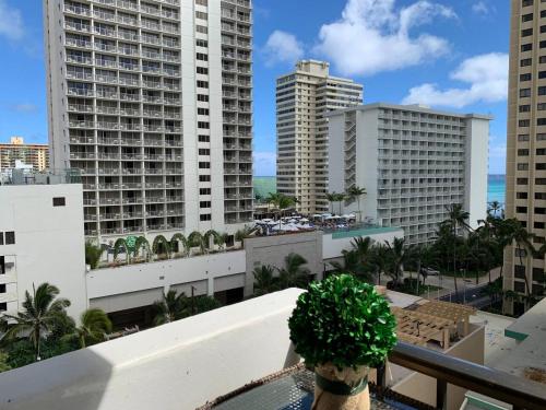 a view of the city from the balcony of a building at WELLCOME TO LOVELY CONDO 2 BEDS 2 BATHS FREE PARKING IN WAIKIKI BEACH in Honolulu