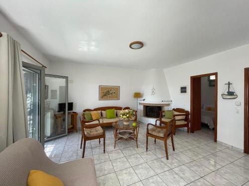 a living room with a couch and a table at Periyali in Keratea