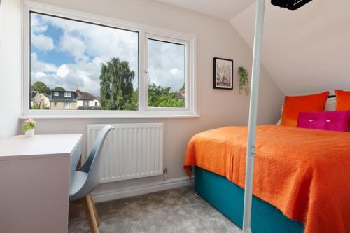 a bedroom with a bed and a window at Home away from home in Sheffield