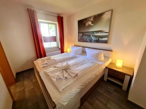 Boddenhus Apartmentにあるベッド