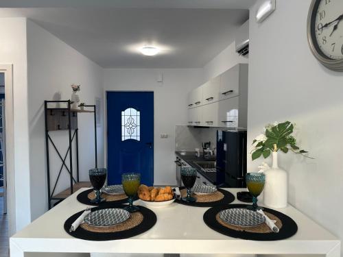 a kitchen with two plates of food on a counter at Kato Zaros Apartments in Zaros