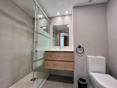 a bathroom with a shower and a sink and a toilet at Beautiful duplex modern apartment in Calpe - Inmodream Calpe in Ifach