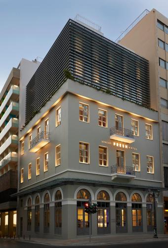 a large white building with a black roof at Fresh Hotel, a member of Design Hotels in Athens