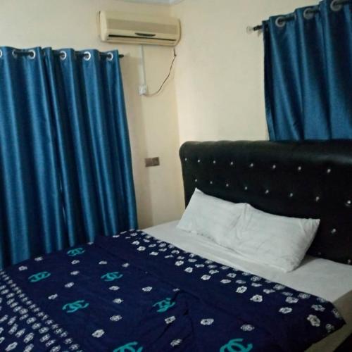 Postel nebo postele na pokoji v ubytování Funkytee Hotel & Apartment