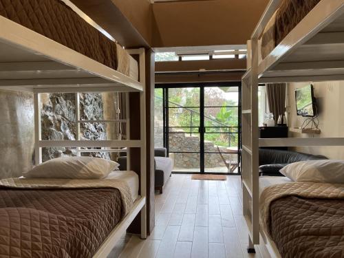 two bunk beds in a room with a view at Maesa Greenery Hill SHA in Mae Rim