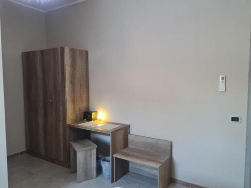 a room with a wooden desk with a candle on it at Agriturismo Cara Terra Lucana in Chiaromonte