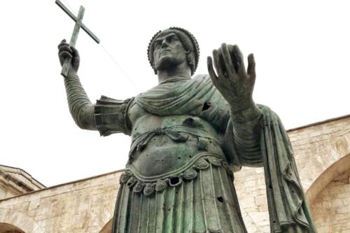 a statue of a god in front of a building at Republic B&B in Bitonto