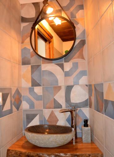 a bathroom with a sink and a mirror at Verderame - Apartment in Licusati