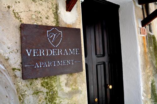 a sign on the side of a building at Verderame - Apartment in Licusati