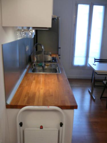 a kitchen with a sink and a wooden counter top at Borgo Medievale Squillace in Squillace