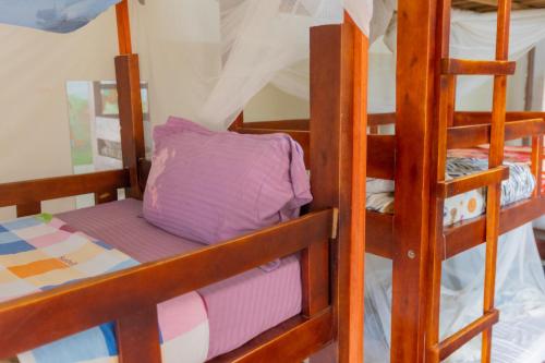 a couple of bunk beds in a room at Acacia Villa Kampala in Kampala