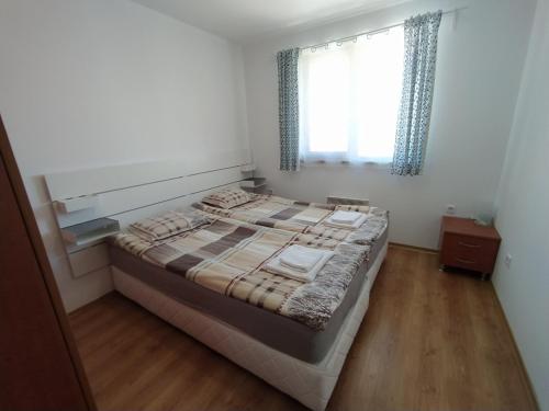 A bed or beds in a room at New Inn